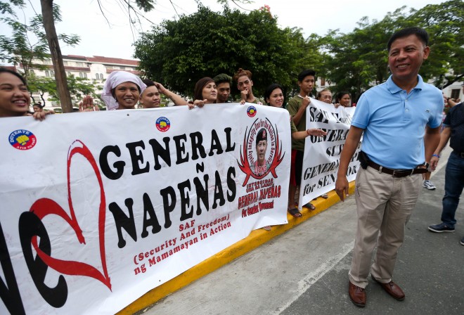 LAST DAY OF FILING OF COCs-COMELEC/OCTOBER 16, 2015 Former PNP SAF chief retired Gen. Getulio Napenas meets with a few supporters across the Manila Cathedral before filing his COC for senator at the COMELEC office in Palacio del Gobernador building, Intramuros.  INQUIRER PHOTO/LYN RILLON