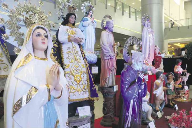 IMAGES of the Virgin Mary, saints and angels are featured in the exhibit “Obra Sagrada” to show the talent of Filipino artisans. PHOTOS BY  E.I. REYMOND T. OREJAS / CONTRIBUTOR 
