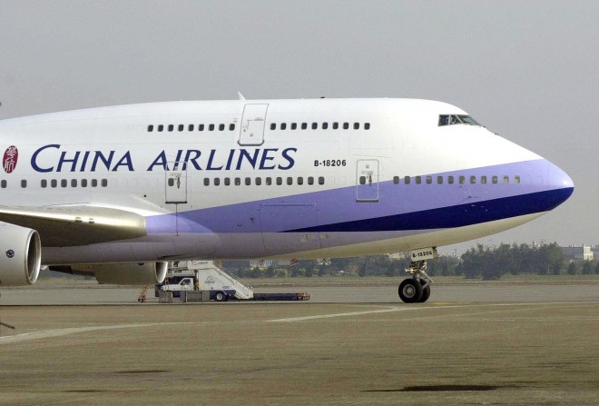 FILE - In this Jan. 26, 2003, file photo, a China Airlines Boeing 747-400 sits on the tarmac at the Chiang Kai-shek International airport in Taoyuan, Taiwan. A woman deported to her homeland Taiwan after giving birth on a China Airlines flight on Oct. 8, 2015, to the U.S. in an apparent attempt to give her baby American citizenship may have to pay hefty compensation for forcing the plane to divert. (AP Photo/Jerome Favre, File)