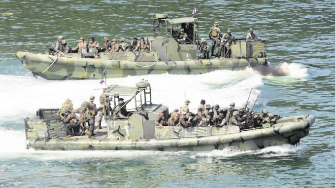 AMID RISING tensions in the West Philippine Sea, Philippine Marines and their US counterparts hold a simulated boat raid at a training center in Ternate, Cavite province, part of the recently concluded nine-day joint military exercise dubbed Phiblex 2016. GRIG C. MONTEGRANDE