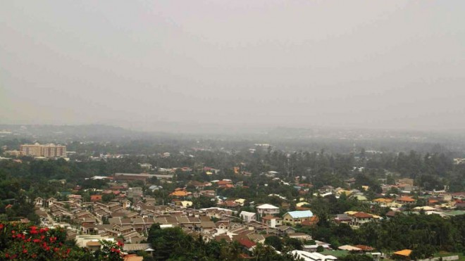 WORSENING PROBLEM  Mindanao is more than 1,200 kilometers from the nearest Indonesian forest fires, but the haze has become a worsening problem across the island, disrupting air traffic and endangering public health. The picture above shows dense haze hanging over Davao City on Friday morning, obscuring visibility for airline pilots. DENNIS SANTOS/INQUIRER MINDANAO 