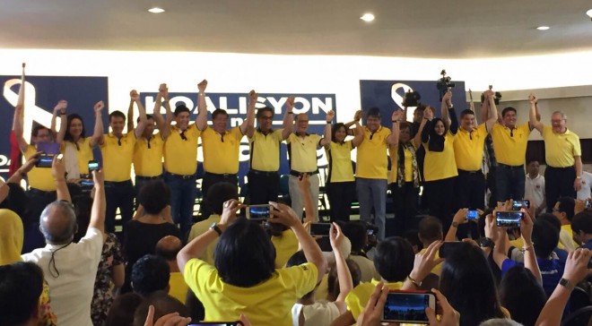 President Benigno Aquino, Liberal Party standard-bearer Mar Roxas and his running-mate Rep. Leni Robredo raise the hands of the members of the 12-man senate slate dubbed Koalisyon ng Daang Matuwid. JULLIANE LOVE DE JESUS/INQUIRER.net