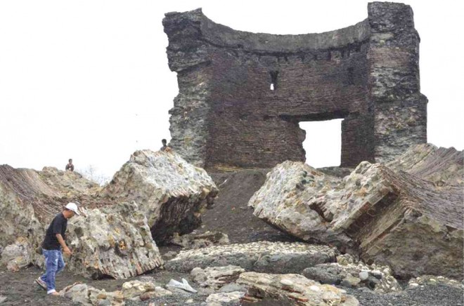 THE OTHER half of the Spanish-era watchtower, which stands on a stony beach in the village of Victoria in Luna, La Union province, crumbled as strong waves scoured the coastline when Typhoon “Lando”  (international name: Koppu) battered northern Luzon this week. CONTRIBUTED PHOTO