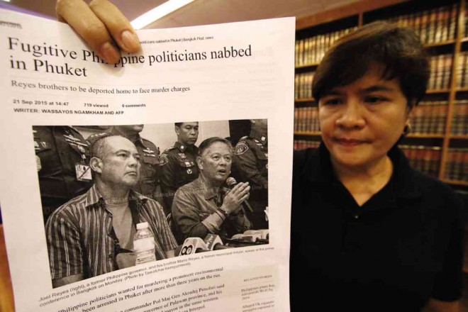 PATTY Ortega, widow of slain journalist and Reyes critic Dr. Gerry Ortega, shows a picture of the Reyes brothers after news about their arrest in Thailand broke out. RICHARD A. REYES