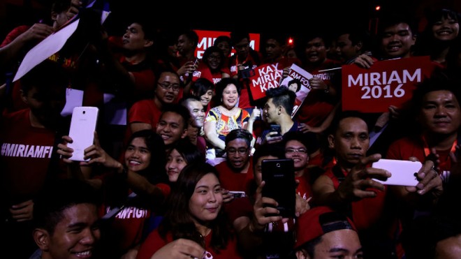 MIRIAM AND ADMIRERS Supporters surround and take selfies with Sen.Miriam Defensor-Santiago, who is running for President in the 2016 elections, during a meeting on Monday at Ang Bahay ng Alumni on the University of the Philippines campus in Diliman,Quezon City. RICHARD A. REYES
