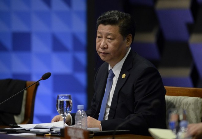 China's President Xi Jinping takes part in the leaders' "Retreat 1" at the annual 21-member Asia-Pacific Economic Cooperation (APEC) summit in Manila on November 19, 2015.  Asia-Pacific leaders are wrapping up two-days of talks in Manila that have been overshadowed by an arm-wrestle for regional influence between the United States and China.  AFP PHOTO / POOL / NOEL CELIS / AFP / POOL / NOEL CELIS