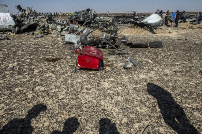 Debris of the A321 Russian airliner lie on the ground a day after the plane crashed in Wadi al-Zolomat, a mountainous area in Egypt's Sinai Peninsula, on November 1, 2015. International investigators began probing why the Russian airliner carrying 224 people crashed in the Sinai Peninsula, killing everyone on board, as rescue workers widened their search for missing victims. AFP PHOTO / KHALED DESOUKI