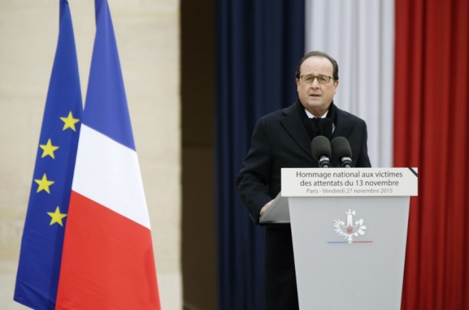 French President Francois Hollande delivers a speech during a solemn ceremony on November 27, 2015 at the Hotel des Invalides, for the National Tribute to the 130 people killed in the November 13 Paris attacks. Families of those killed in France's worst-ever terror attack, claimed by the Islamic State (IS) group, will join some of the wounded at ceremonies at the Invalides   AFP PHOTO / POOL / PHILIPPE WOJAZER / AFP / POOL / PHILIPPE WOJAZER