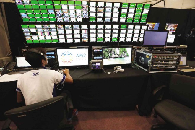  FROM PASAY  TO THE WORLD  The master control room of the Asia-Pacific Economic Cooperation (Apec) International Media Center at the World Trade Center in Pasay City, goes on a trial run Thursday, ahead of the 21-state Apec Summit next week. JOAN BONDOC 