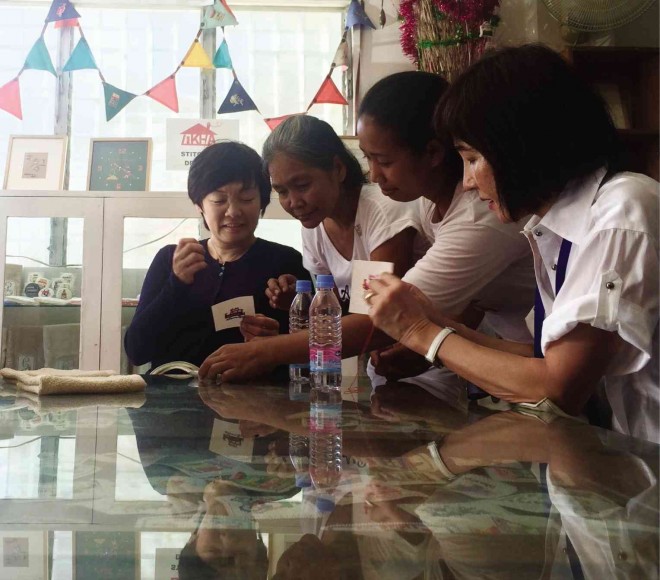  JAPAN’S first lady, Akie Abe (left), meets  the beneficiaries of a Japanese-backed foundation in Payatas, Quezon City. Erika Sauler