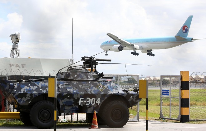 November 15, 2015 An APC (Armoured Personnel Carrier) tank guards the perimeter of the NAIA Terminal 1 as APEC delegates start arriving in the country this monday. INQUIRER/ MARIANNE BERMUDEZ