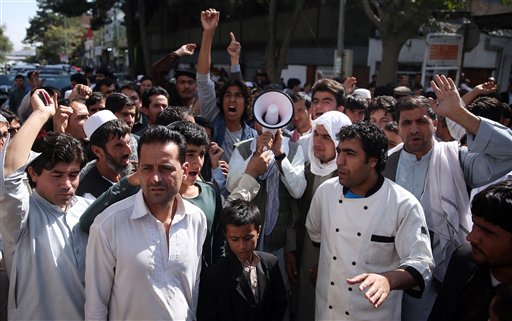 Afghan protesters shout slogans during a demonstration against government, in Kabul, Afghanistan, Wednesday, Oct. 7, 2015. An Afghan official says government troops have regained control of the main square in Kunduz, a strategic northern city briefly seized by Taliban insurgents last week. (AP Photos/Massoud Hossaini)