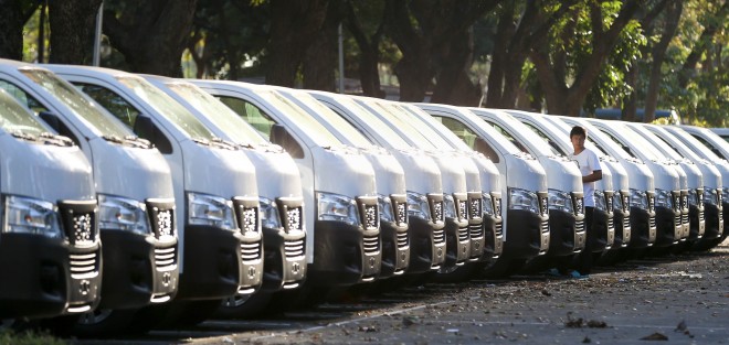 APEC PREPARATIONS/NOVEMBER 03, 2015 APEC preparations: A staff from Europcar, a rental car service, passes by new car units for use in APEC 2015 (October 25-November 25, 2015). One of its managers, Anthony Villarin, says that an estimated 950 units of different car brands/models will be used for the event to transport APEC staff, foreign dignitaries including their staff, security personnel, embassy personnel and others. The cars are currently held at the parking lot across PICC Pasay City. INQUIRER PHOTO/LYN RILLON