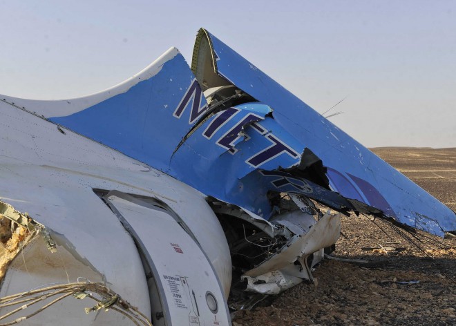 This photo released by the Prime Minister's office shows the tail of a Metrojet plane that crashed in Hassana, Egypt on Saturday, Oct. 31, 2015. The Russian aircraft carrying 224 people crashed Saturday in a remote mountainous region in the Sinai Peninsula about 20 minutes after taking off from a Red Sea resort popular with Russian tourists, the Egyptian government said. There were no survivors. (Suliman el-Oteify/Egyptian Prime Minister's Office via AP)