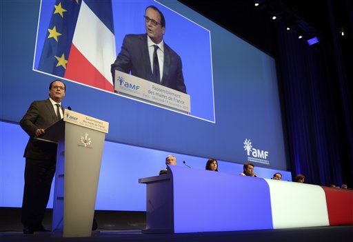 French President Francois Hollande delivers a speech during a meeting with French mayors in Paris, Wednesday Nov. 18, 2015.  French President Francois Hollande says France is 'at war' against terrorism by the Islamic State group. (Stephane de Sakutin, Pool Photo via AP)