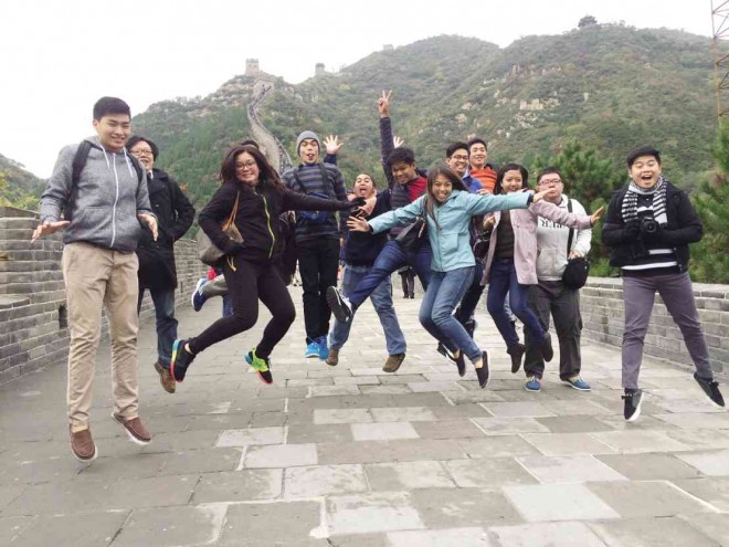 JUMPING for joy at where else but the Great Wall, one of must-see places the Huawei-sponsored group visited in Beijing.