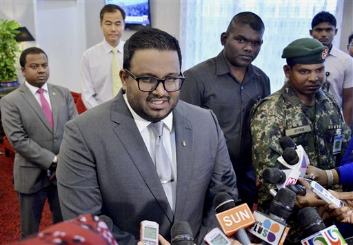 In this photo taken on Tuesday, Oct. 13, 2015, Maldives Vice President Ahmed Adeeb speaks to media at the Ibrahim Nasir International Airport, near Male, Maldives. The vice president of the Maldives will be charged with high treason after being arrested Saturday, Oct. 24, 2015 in connection with an explosion aboard the president's boat last month that authorities have called an assassination attempt, officials said. (Ali Naseer/Sun Media Group via AP) 