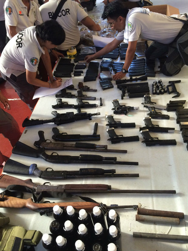 High power firearms and airsoft guns were confiscated during the latest raid at the Maximum Security Compound of the New Bilibid PrisoN. PHILIPPINE DAILY INQUIRER/EDWIN BACASMAS