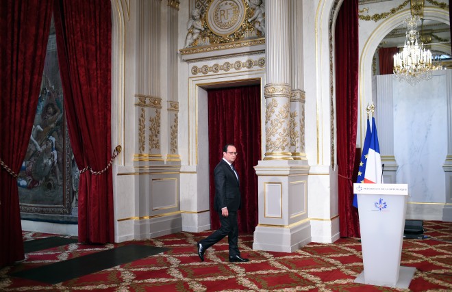 French President Francois Hollande arrives to speak at the Elysee palace in Paris, Saturday Nov. 14, 2015, following a series of coordinated attacks in and around Paris Friday.  Hollande vowed to attack the Islamic State group without mercy as the jihadist group admitted responsibility Saturday for orchestrating the deadliest attacks inflicted on France since World War II. (Stephane de Sakutin, Pool photo via AP)