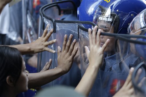 Student protesters clash with police near the US Embassy ahead of the Asia-Pacific Economic Cooperation (APEC) summit in Manila, Philippines Tuesday, Nov. 17, 2015.   AP