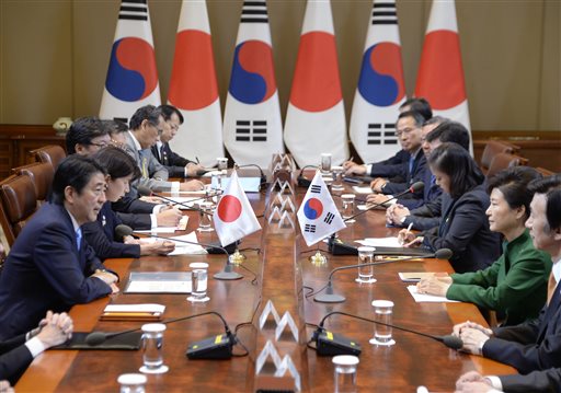 Japanese Prime Minister Shinzo Abe, left, and South Korean President Park Geun-hye, second from right, attend a meeting at the presidential Blue House in Seoul, South Korea, Monday, Nov. 2, 2015. (Song Kyung-seok/Pool Photo via AP)
