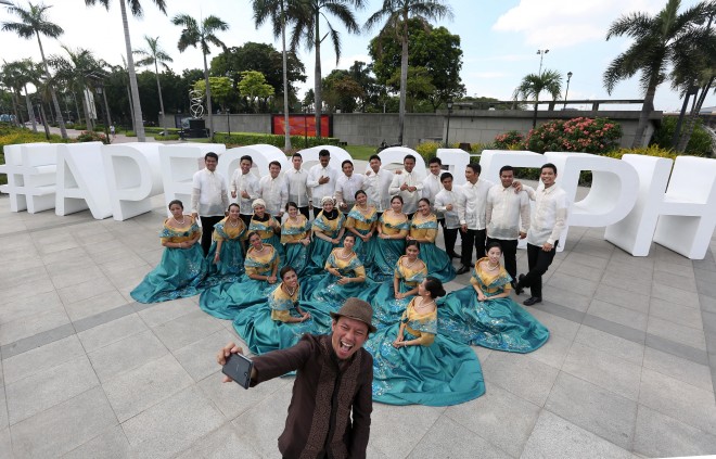 Members of the National Youth Commission in dressed in their Filipinianas take a selfie with the APEC2015PH standee in the background at the Luneta Park, as the country anticipates the World Leader's summit on Nov. 18-19. INQUIRER/ MARIANNE BERMUDEZ
