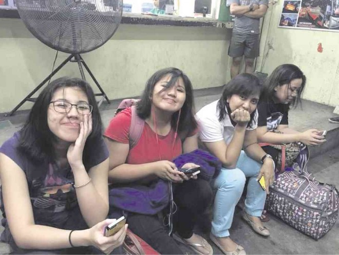 CAMARINES SUR Rep. Leni Robredo and her daughters wait for a bus ride to Naga City in this photo taken by Kaye Lawrence Luz and posted on her Facebook account.