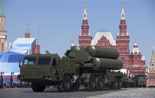 In this Tuesday May 7, 2013 file photo, Russian S-400 air defense missile systems make their way through Red Square during a rehearsal for the Victory Day military parade in Moscow,  Russia. In a move raising the potential threat of a Russia-NATO conflict, Russia said Wednesday Nov. 24, 2015 it will deploy long-range air defense missiles to its base in Syria and destroy any target that may threaten its warplanes following the downing of a Russian military jet by Turkey. (AP Photo/Alexander Zemlianichenko, File)