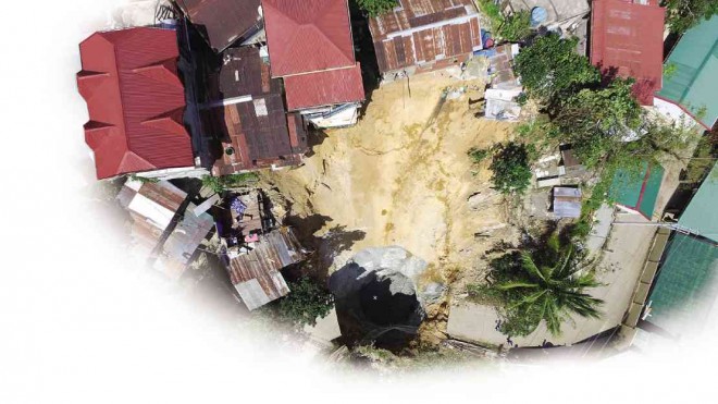 SEVEN houses fell into this massive hole that opened up on Oct. 22,  drawing the attention of geologists from the University  of the Philippines.------------sinkhole1    ELIZA CONSUL/CONTRIBUTOR
