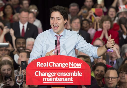 In this Oct. 20, 2015, file photo, Prime minister designate Justin Trudeau speaks to supporters at a rally in Ottawa, Ontario. Trudeau will be sworn in Wednesday, Nov. 4 as prime minister, the position long held by his late father, as Canada begins a new era of Liberal leadership after Conservative Stephen Harper's near-decade in power. (Adrian Wyld/The Canadian Press via AP, File) 