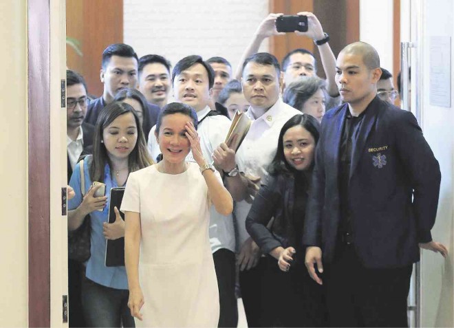 GOODNESS GRACIOUS Sen. Grace Poe with a bevy of supporters at her press conference in Pasay City on Wednesday where she blames two of her closest rivals as those behind her disqualification by the Commission on Elections’ Second Division from the presidential race. A veteran election lawyer says she is in for a bruising battle to overturn the decision of the Comelec’s Second Division. RAFFY LERMA