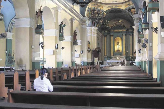 WHERE IT ALL BEGAN  Sen. Grace Poe, a presidential candidate, finds solace at Jaro Metropolitan Cathedral in Iloilo City, where 47 years ago she was left as a newborn, with her biological parents unknown to this day. Detractors have filed disqualification cases against her on grounds that as a foundling she is not a natural-born Filipino and thus barred from running for President. CONTRIBUTED PHOTO 