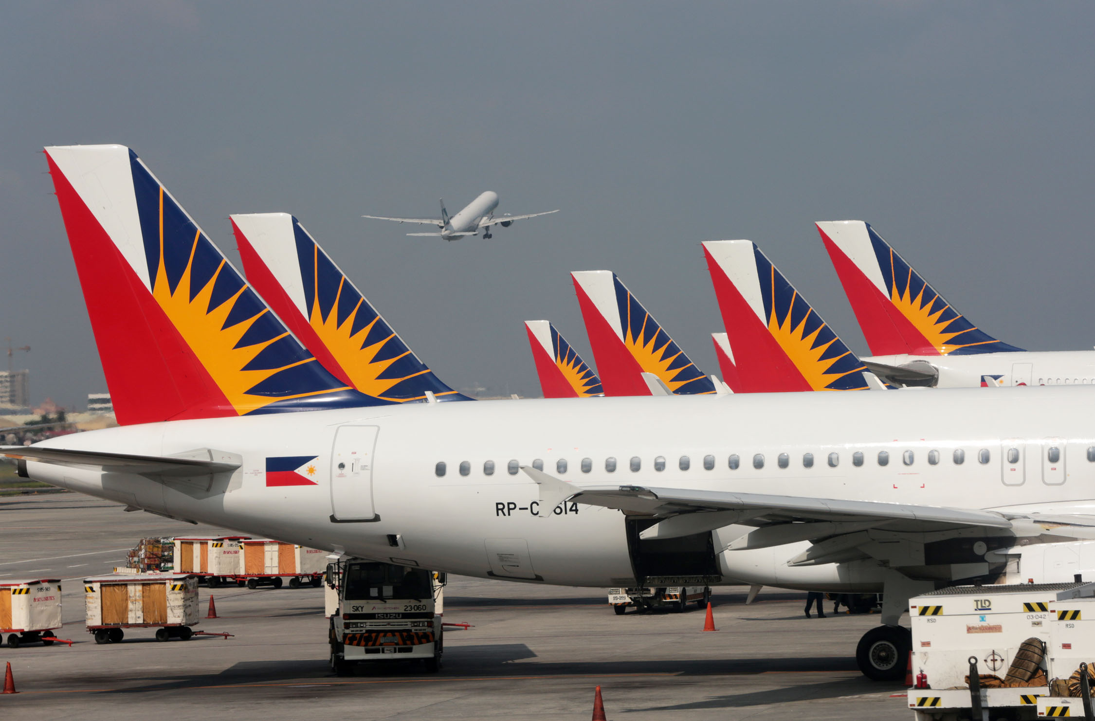 File photo of the Philippine Airlines planes at the NAIA Terminal 2. INQUIRER PHOTO / GRIG C. MONTEGRANDE