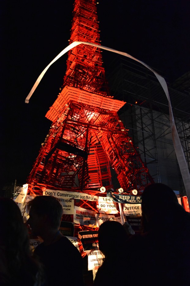 Climate activists "teepee" a replica of the Eiffel Tower at the 21st Conference of Parties in Paris. Photo by Kristine Angeli Sabillo/INQUIRER.net