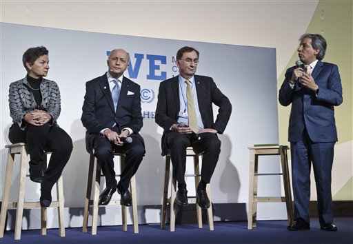 From left, United Nations climate chief Christiana Figueres, French Foreign Minister Laurent Fabius, U.N. delegate Janos Pasztor and Minister of Environment of Peru, Manuel Pulgar Vidal, attend the"Action Day", while , 2nd right, sit next to him at the COP21, United Nations Climate Change Conference,  in Le Bourget north of Paris, Saturday, Dec. 5, 2015. President Francois Hollande is encouraging mayors of the world to get involved in fighting climate change and praising those that are already setting an example with low-emission buildings and public transport policies. United Nations climate chief Christiana Figueres, (AP PhotoMichel Euler)