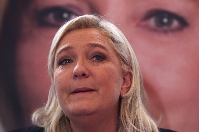French far-right leader and National Front Party, Marine Le Pen, addresses the media during a news conference, Monday, Dec. 7, 2015, in Lille, northern France. France's far-right National Front ran strongly in a first-round regional vote that was the first election since an attack by Islamic extremists left 130 dead in Paris. The National Front was leading in six of the 13 regions, including two where it was strongly ahead. (AP Photo/Michel Spingler)