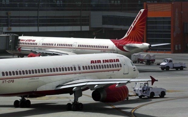 FILE - In this May 18, 2012 file photo, Air India planes are parked on the tarmac at the Terminal 3 of Indira Gandhi International Airport in New Delhi, India.  An Air India plane flying to London was forced to return to Mumbai after passengers spotted a rat on board, the airline said Thursday, Dec. 31, 2015. (AP Photo/Kevin Frayer, File)