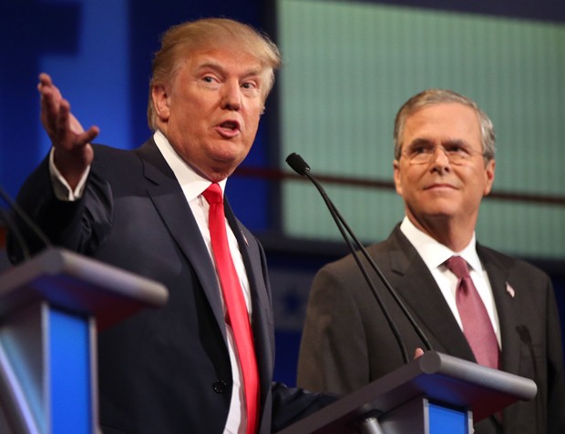 FILE - In this Aug. 6, 2015, file photo, Republican presidential candidates Donald Trump and Jeb Bush participate in the first Republican presidential debate at the Quicken Loans Arena in Cleveland. Presidential debates were big draws and big business for the networks that presented them in 2015 _ at least, when Donald Trump was involved. The first Republican debate was watched by 24 million viewers, the highest-rated broadcast in Fox News Channel's history.  (AP Photo/Andrew Harnik, File)