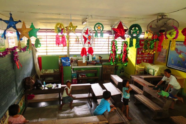 Evacuees feel comforted by the presence of different Christmas lanterns hanged in classrooms turned evacuation centers at the Cabangan Elementary School in Camalig town while Albay province is bracing for Typhoon Nona. / photos by Michael B. Jaucian, Inquirer Southern Luzon
