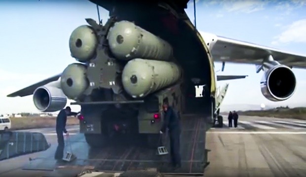 This photo made from the footage taken from Russian Defense Ministry official web site on Friday, Nov. 27, 2015, shows a Russian S-400 air defense missile systems being unloaded from an An-124 Ruslan cargo plane at the Hemeimeem air base in Syria, about 50 kilometers (30 miles) south of the border with Turkey. Russia’s President Vladimir Putin has ordered the deployment of the S-400s to the Russian base in Syria to help protect Russian warplanes after Turkey downed a Russian military jet at the border with Syria on Tuesday. (Russian Defense Ministry Press Service pool photo via AP)