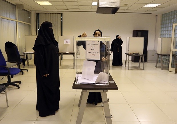 Saudi women vote at a polling center during municipal elections, in Riyadh, Saudi Arabia, Saturday, Dec. 12, 2015. Saudi women are heading to polling stations across the kingdom on Saturday, both as voters and candidates for the first time in this landmark election. (AP Photo/Aya Batrawy)