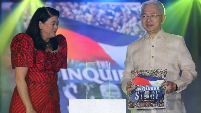 FIRST COPY The first copy of the book “The Inquirer Story: 30 Years of Shaping History” is received by UP president Alfredo Pascual (right) from  Inquirer president and CEO Sandy Prieto-Romualdez. The commemorative book was launched on Saturday.  RAFFY LERMA 