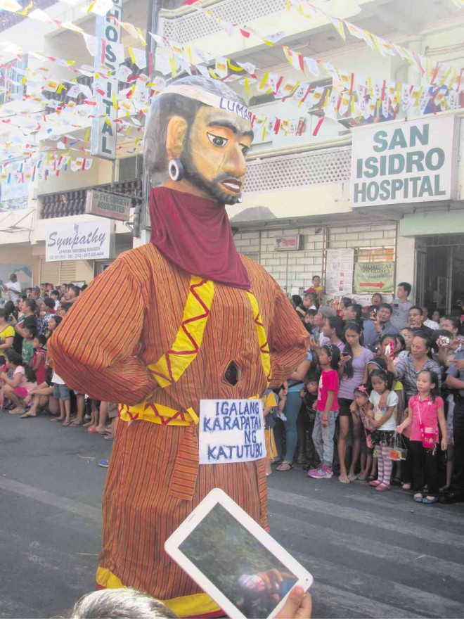 POLITICAL STAND. A giant papier-mâché creature dressed like a “lumad” and calling for respect the rights of indigenous peoples is among the figures that joined the Higantes Festival in Angono, Rizal province. Mariejo Mariss S. Ramos