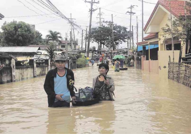 CALUMPIT town in Bulacan province gets flooded each time a strong storm passes by Central Luzon. This month, flooding was exacerbated by the release of water from Angat Dam.  CARMELA REYES-ESTROPE/INQUIRER CENTRAL LUZON