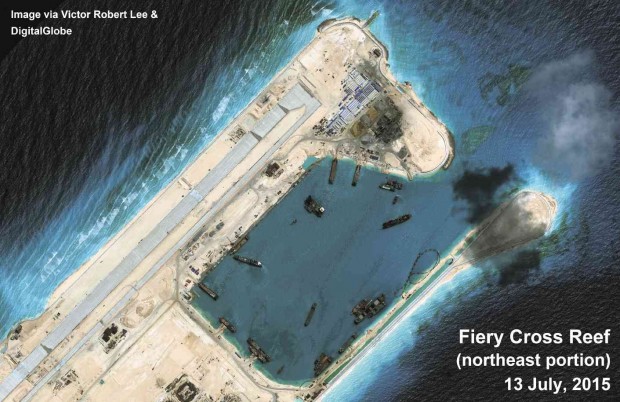 Photo from the air shows construction activities undertaken by China on Kagitingan Reef (Fiery Cross Reef), including an airstrip, in a disputed area in the South China Sea. The Philippines and China are among several countries disputing ownership of the reefs located on the Spratly Islands. PHOTO BY VICTOR ROBERT LEE AND DIGITALGLOBE 