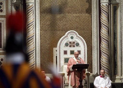 Pope Francis delivers his homily during a mass after opening the Holy Door of St. John in Lateran Basilica in Rome, Sunday, Dec. 13, 2015. (AP Photo/Gregorio Borgia)