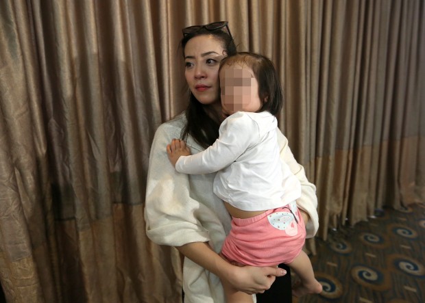 JINKY MENORCA/JAN.21,2016 Jinky Menorca wife of former Iglesia ni Cristo (INC)  minister Lowell Menorca and their child during a press conference in Greenhills, San Juan. INQUIRER PHOTO/RAFFY LERMA