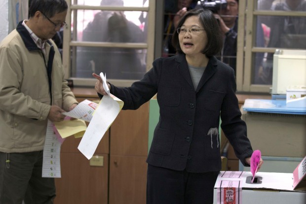 Taiwan's Democratic Progressive Party (DPP) presidential candidate Tsai Ing-wen prepares to cast her vote at a polling station for the presidential election in Taipei, Taiwan, Saturday, Jan. 16, 2016. Voting began Saturday in the presidential election in which the island's China-friendly Nationalist Party appears likely to lose power to the pro-independence opposition, amid concerns that the island's economy is under threat from China and broad opposition among voters to Beijing's demands for political unification. (AP Photo/Ng Han Guan)