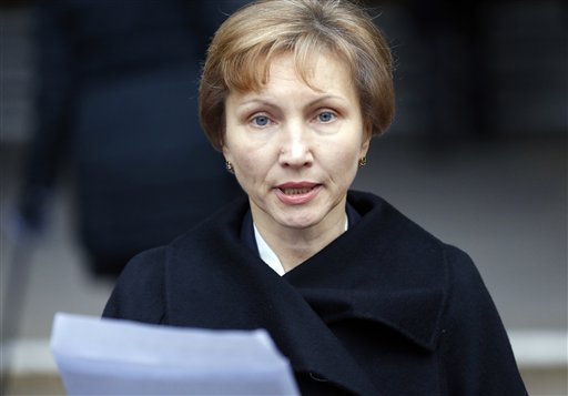Marina Litvinenko, widow of former Russian spy Alexander Litvinenko, reads a statement outside the Royal Courts of Justice in London, Thursday, Jan. 21, 2016. President Vladimir Putin probably approved a plan by Russia's FSB security service to kill former agent Alexander Litvinenko, a British judge said Thursday. (AP Photo/Frank Augstein)