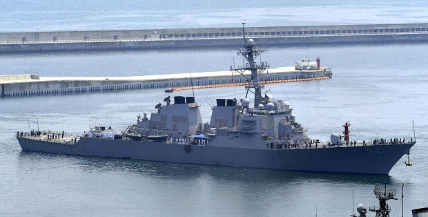 FILE - In this June 4, 2010, file photo, the USS Curtis Wilbur arrives at a naval base in Busan, South Korea, for South Korea-U.S. joint drills. China strongly condemned the United States after the missile destroyer deliberately sailed near one of the Beijing-controlled islands in the hotly contested South China Sea to exercise freedom of navigation and challenge China's vast territorial claims. (Jo Jong-ho/Yonhap via AP) KOREA OUT